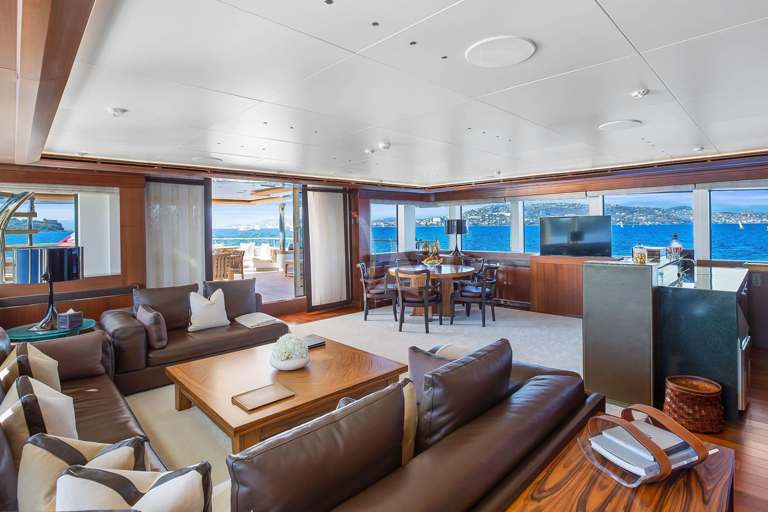 a living room with a large screen aboard MARAYA Yacht for Sale