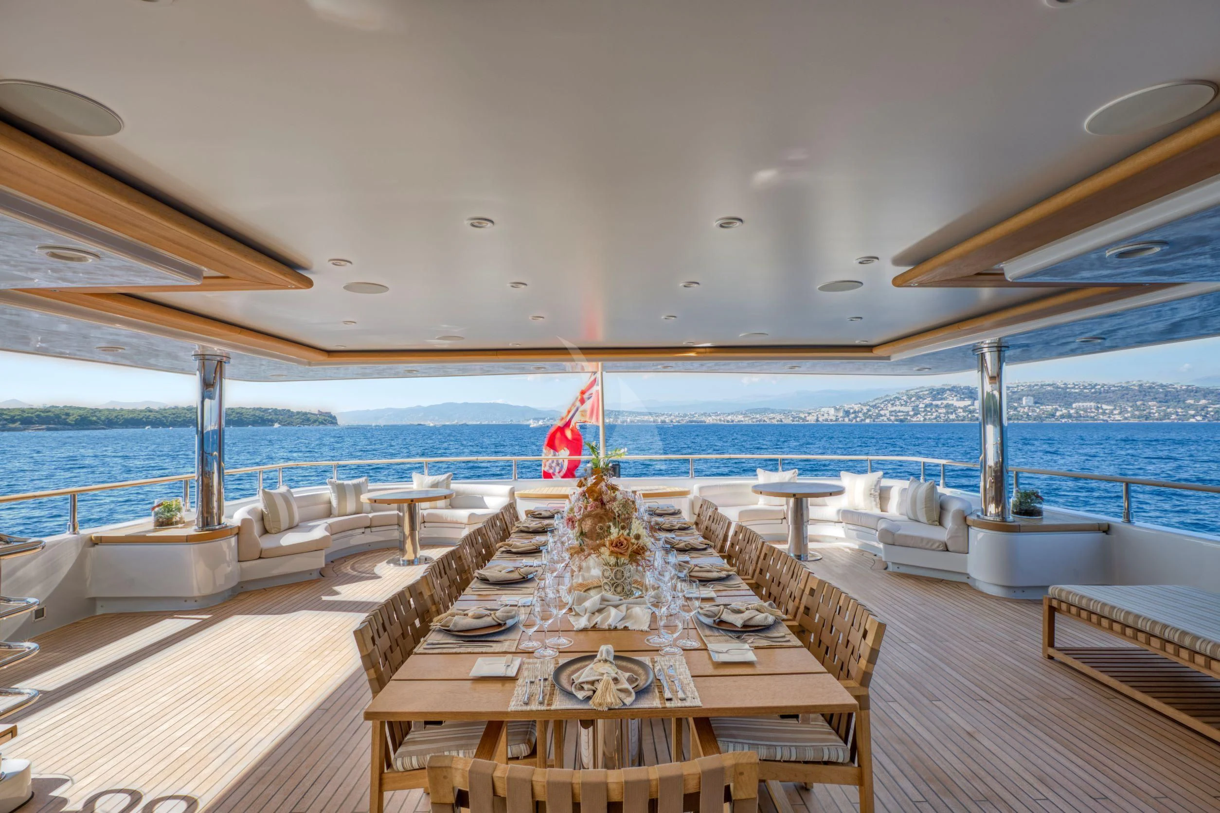 a room with a view of the ocean and a large pool aboard MARAYA Yacht for Sale