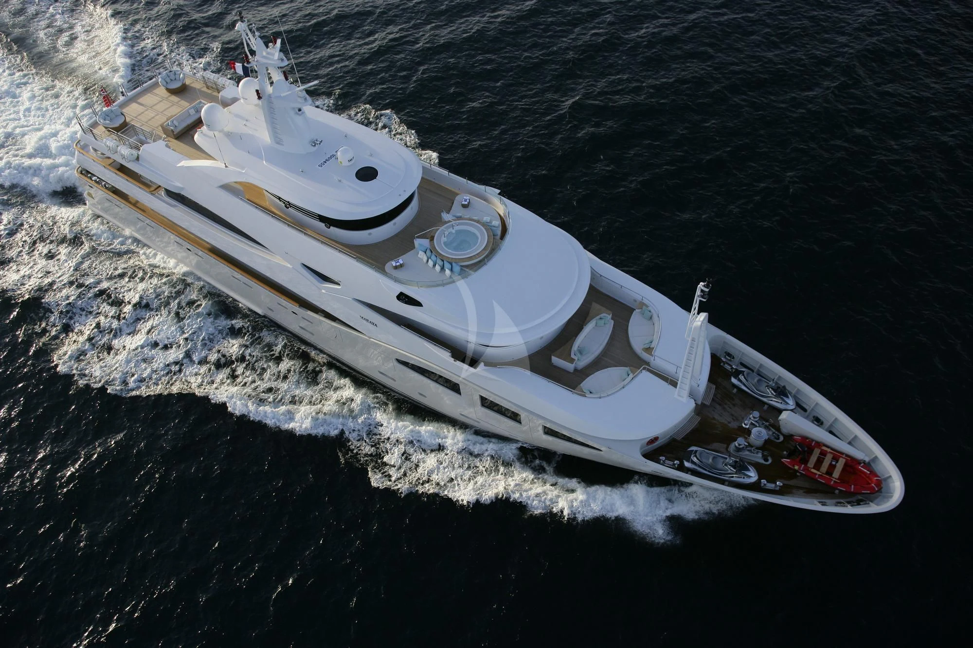 a white boat on a beach aboard MARAYA Yacht for Sale