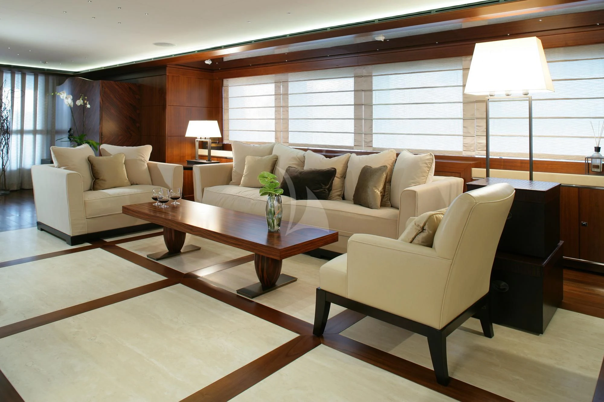 a living room with a couch and a coffee table aboard MARAYA Yacht for Sale