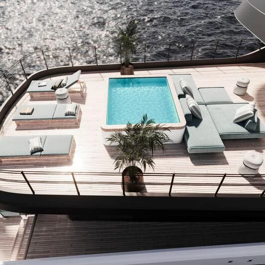 a pool with a table and chairs aboard TERRANOVA 41 Yacht for Sale