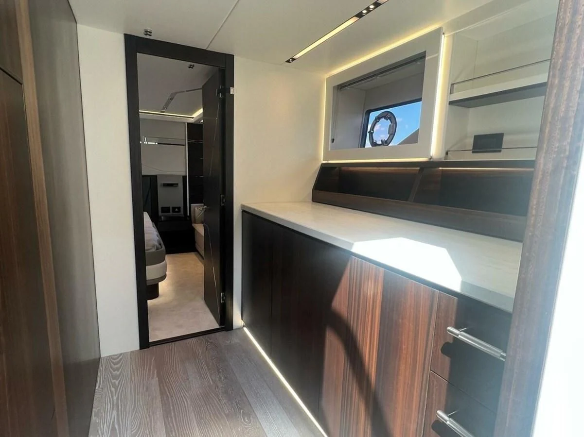 a hallway with a wood floor and a mirror aboard 75 SPORT YACHT Yacht for Sale