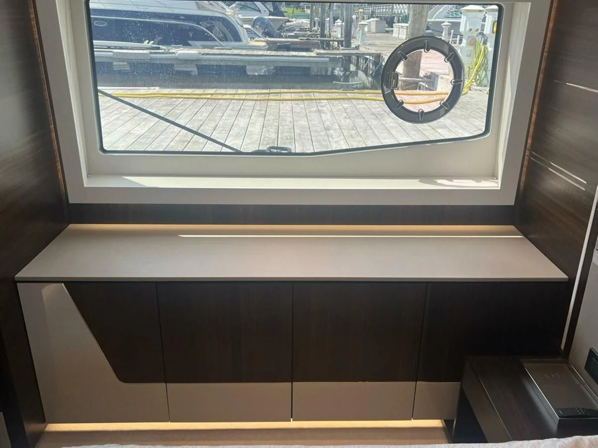a window with a picture of a city in the background aboard 75 SPORT YACHT Yacht for Sale