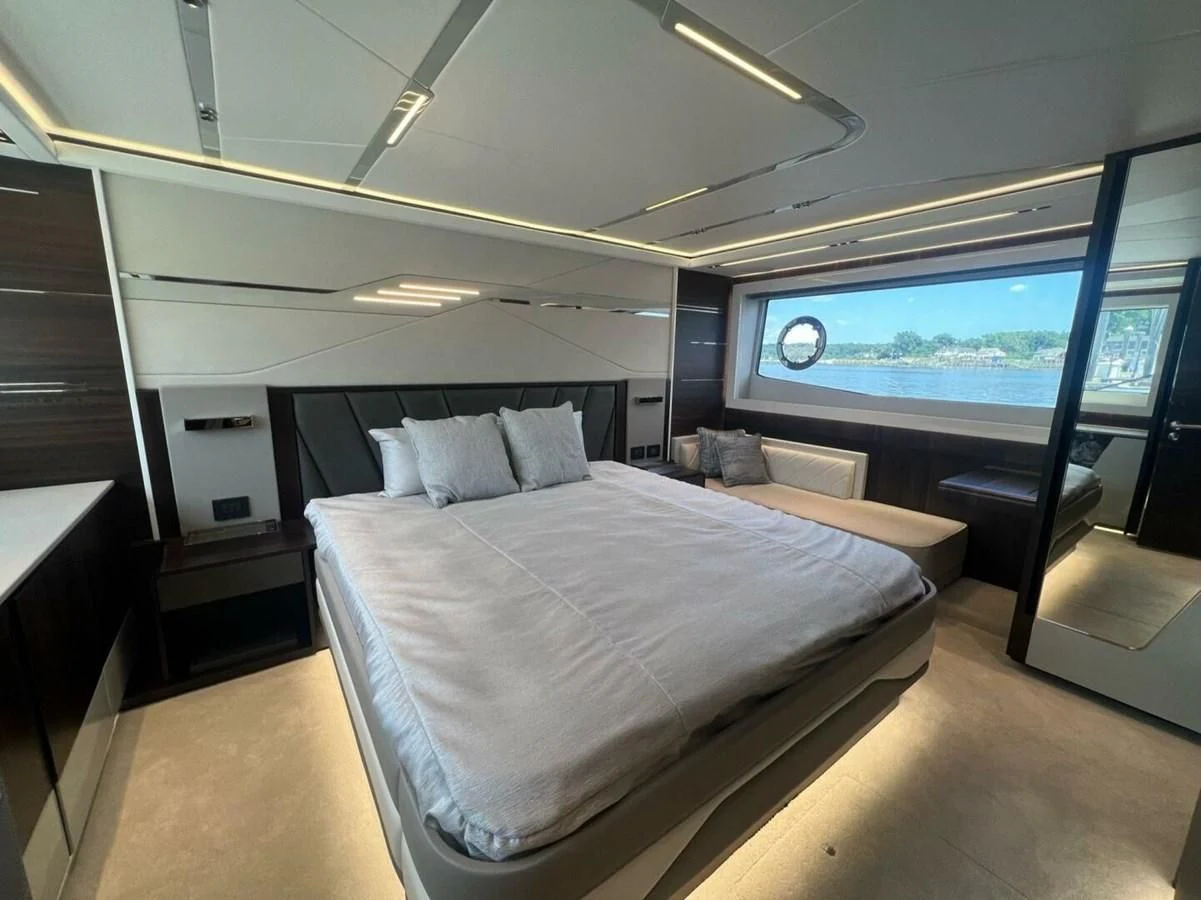 a room with a bed and a window aboard 75 SPORT YACHT Yacht for Sale