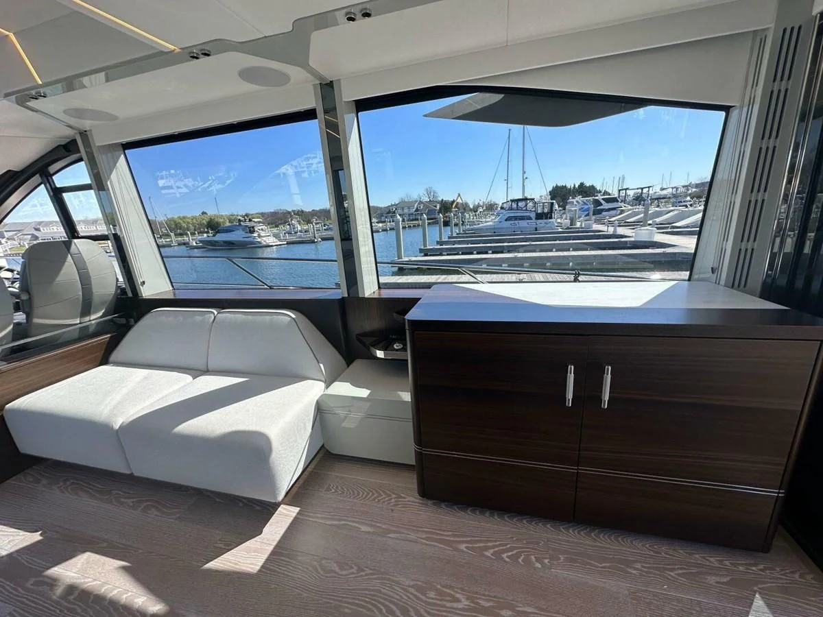 a room with a couch and a window aboard 75 SPORT YACHT Yacht for Sale