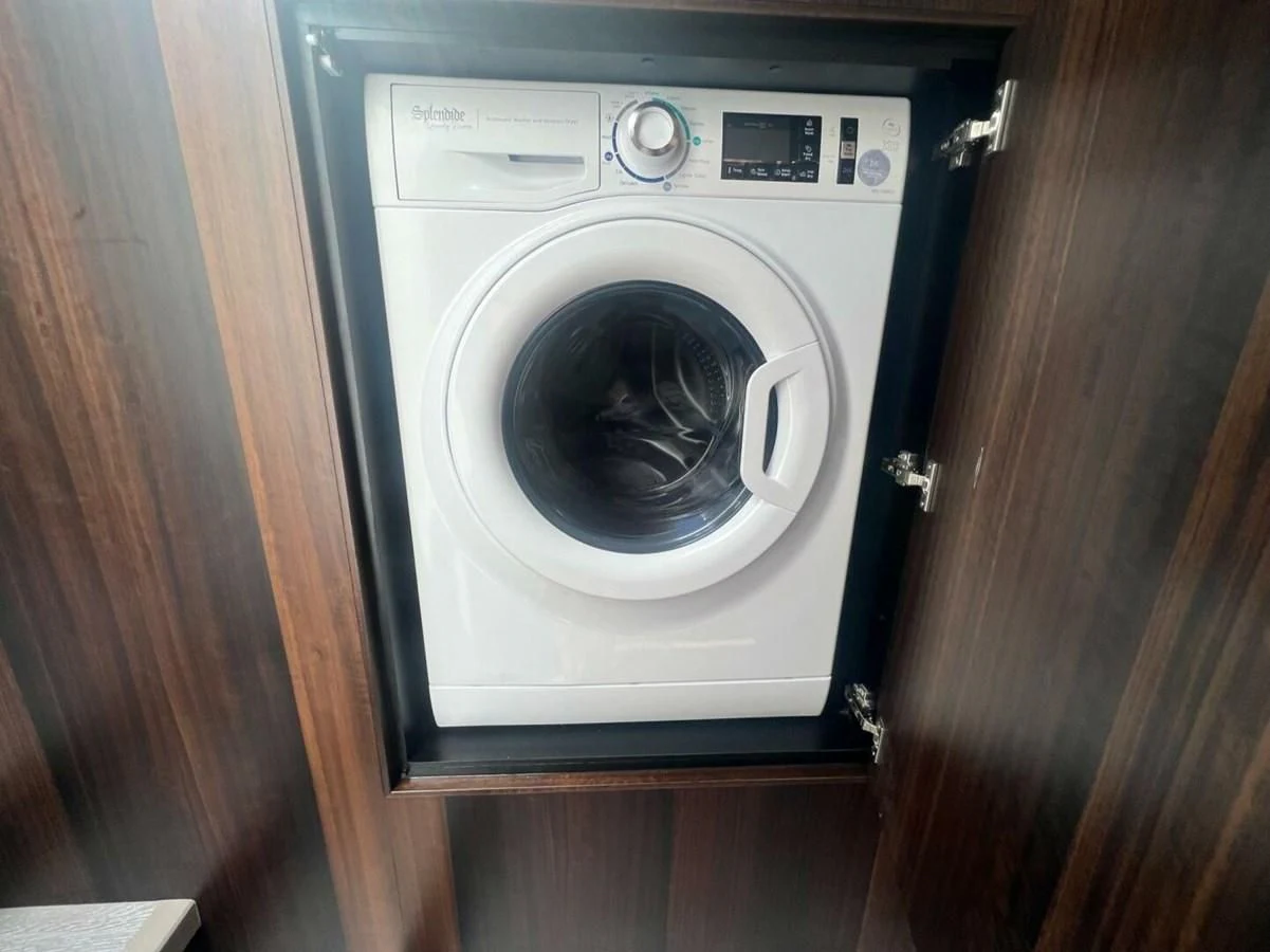 a white rectangular object with a black circle on it aboard 75 SPORT YACHT Yacht for Sale