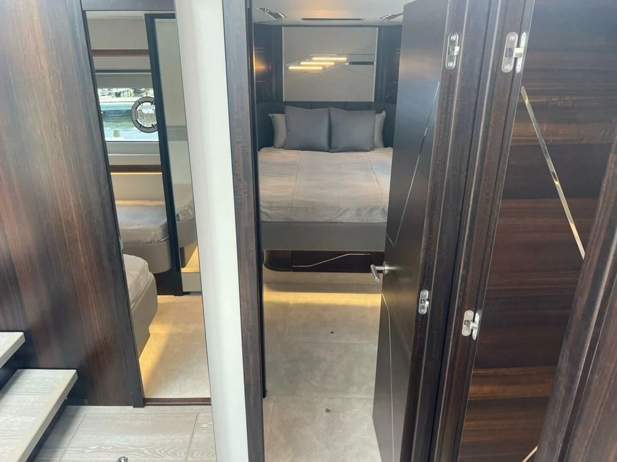 a train with a bed and a bench aboard 75 SPORT YACHT Yacht for Sale