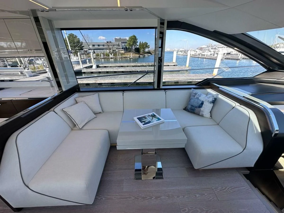 a car with a table and a laptop on a table aboard 75 SPORT YACHT Yacht for Sale