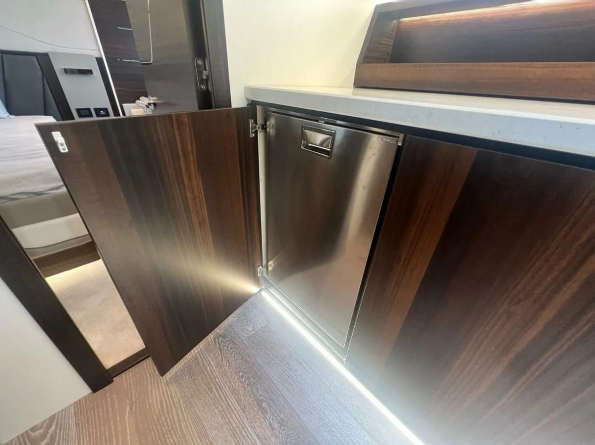 a stainless steel refrigerator in a kitchen aboard 75 SPORT YACHT Yacht for Sale
