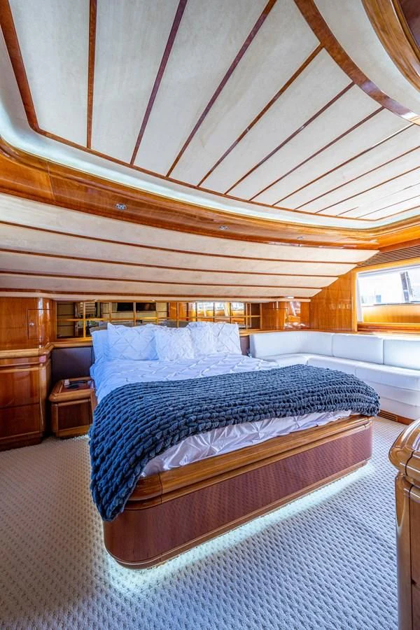 a bed with a canopy over it aboard EVERYTHING GOOD Yacht for Sale