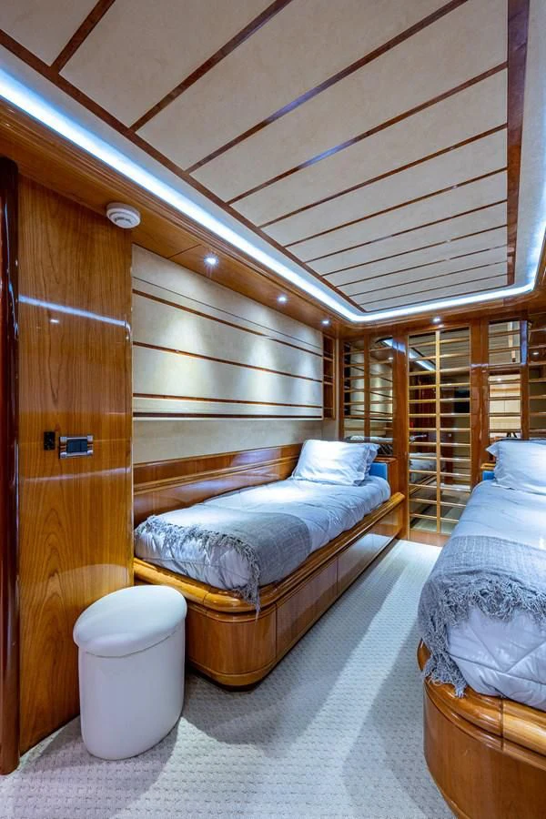 a bedroom with a bed and a ladder aboard EVERYTHING GOOD Yacht for Sale