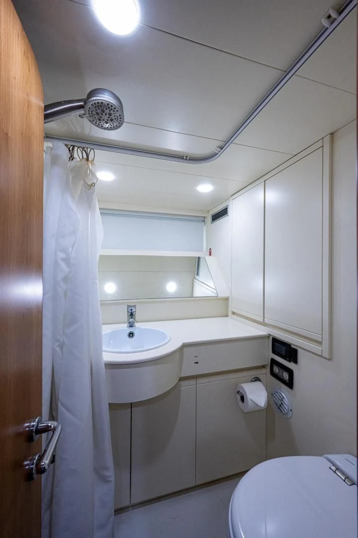 a bathroom with a sink and a shower aboard EVERYTHING GOOD Yacht for Sale