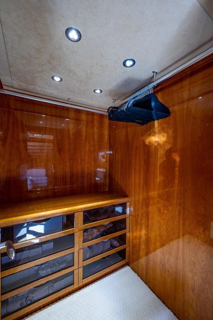 a wooden cabinet with a clear door aboard EVERYTHING GOOD Yacht for Sale