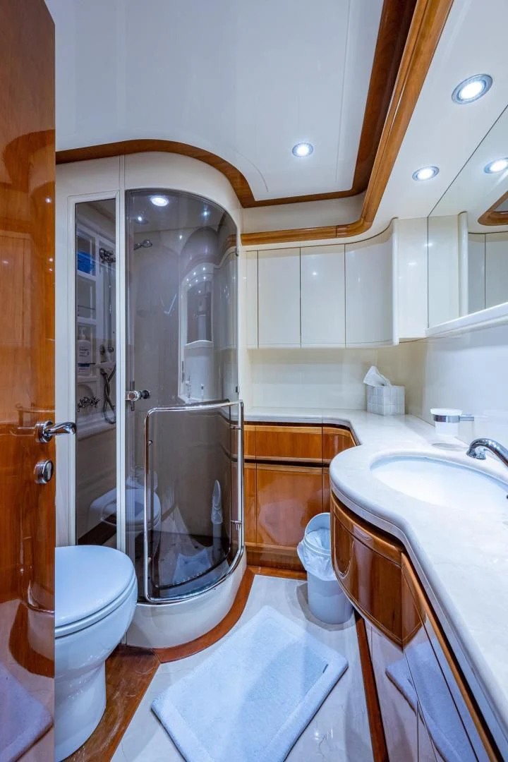 a bathroom with a glass shower aboard EVERYTHING GOOD Yacht for Sale