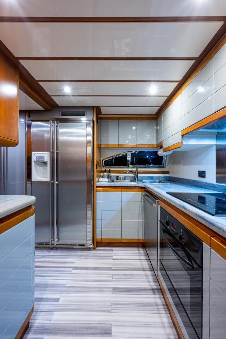 a kitchen with stainless steel appliances aboard EVERYTHING GOOD Yacht for Sale
