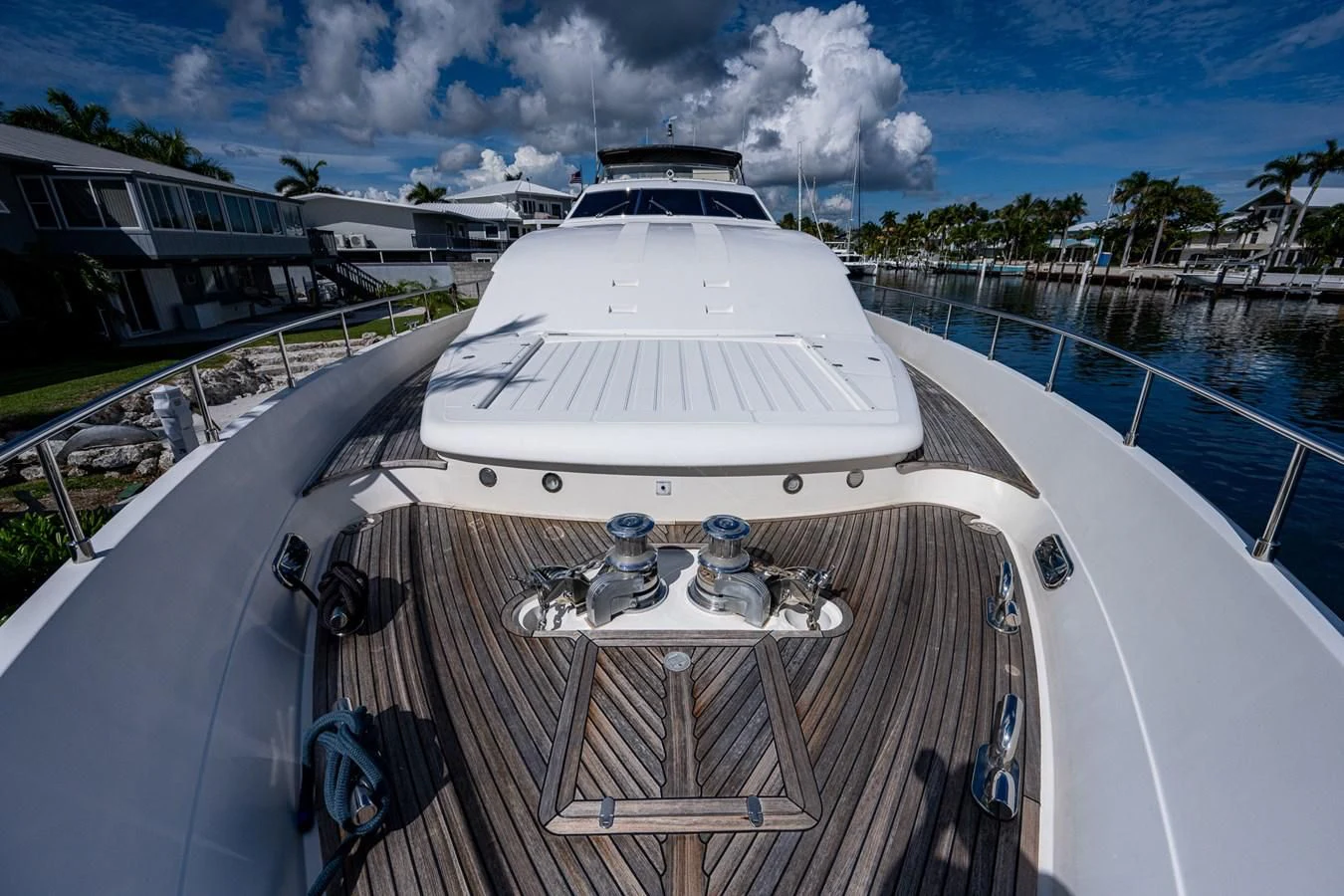 a white yacht on a deck aboard EVERYTHING GOOD Yacht for Sale
