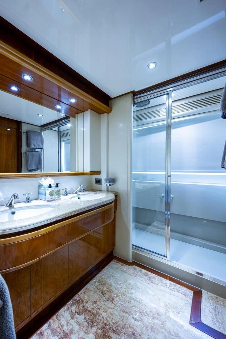 a bathroom with a glass shower aboard EVERYTHING GOOD Yacht for Sale