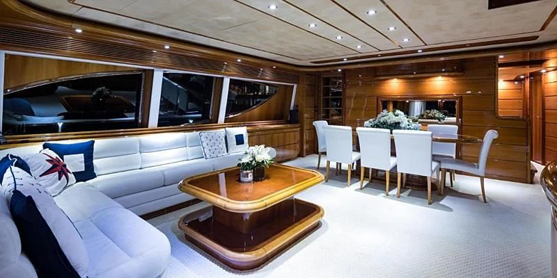 a room with a couch and a table and chairs aboard EVERYTHING GOOD Yacht for Sale