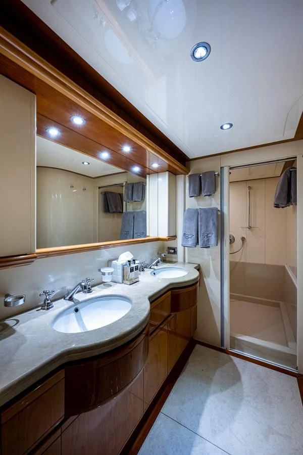 a bathroom with a large mirror aboard EVERYTHING GOOD Yacht for Sale