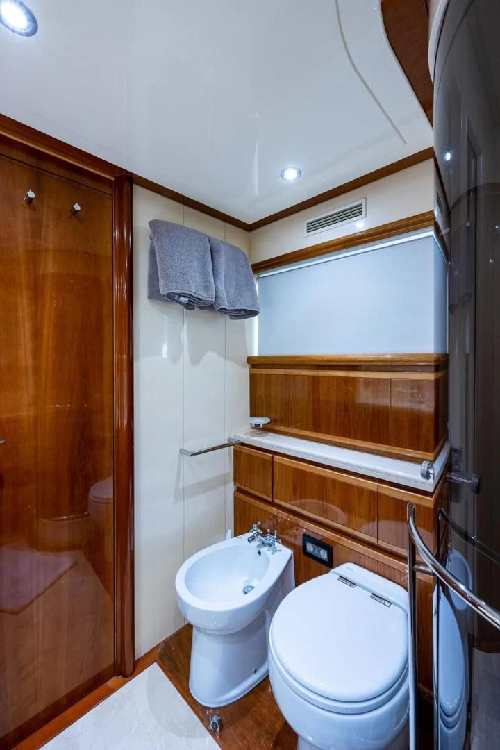 a bathroom with a toilet and a sink aboard EVERYTHING GOOD Yacht for Sale