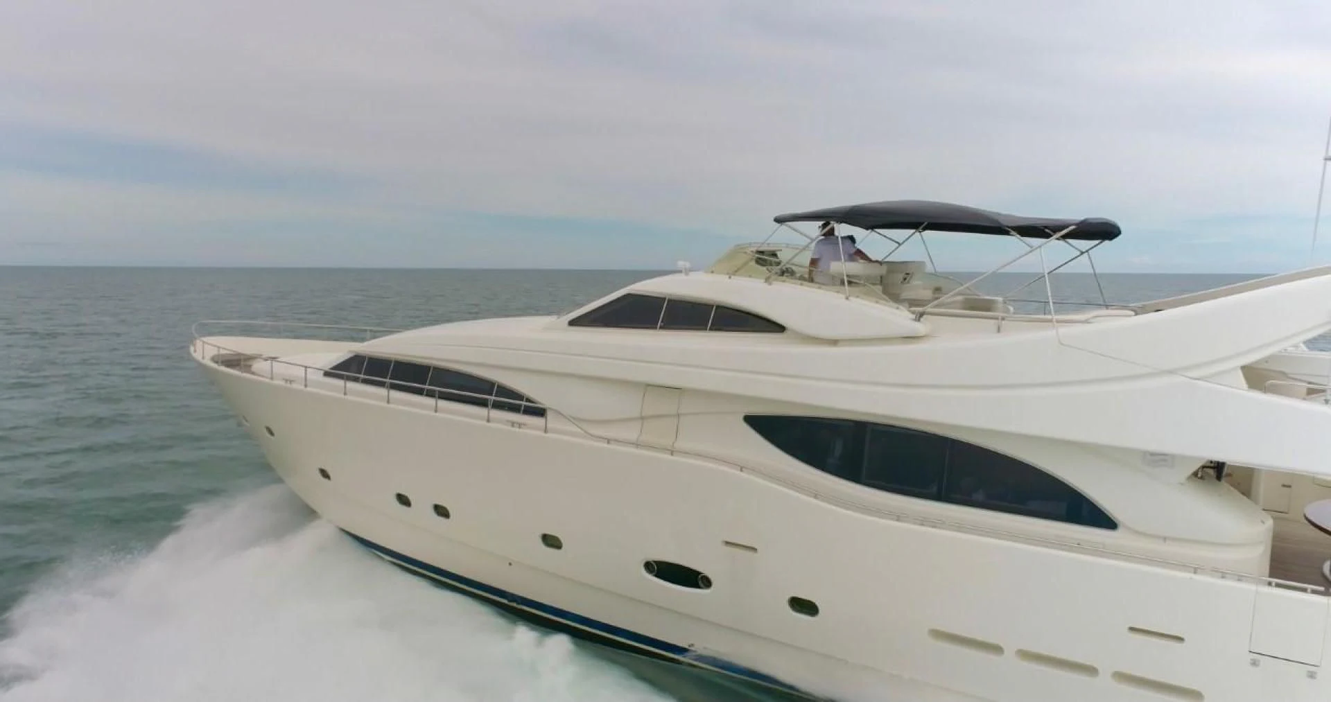 a white yacht on the water aboard EVERYTHING GOOD Yacht for Sale
