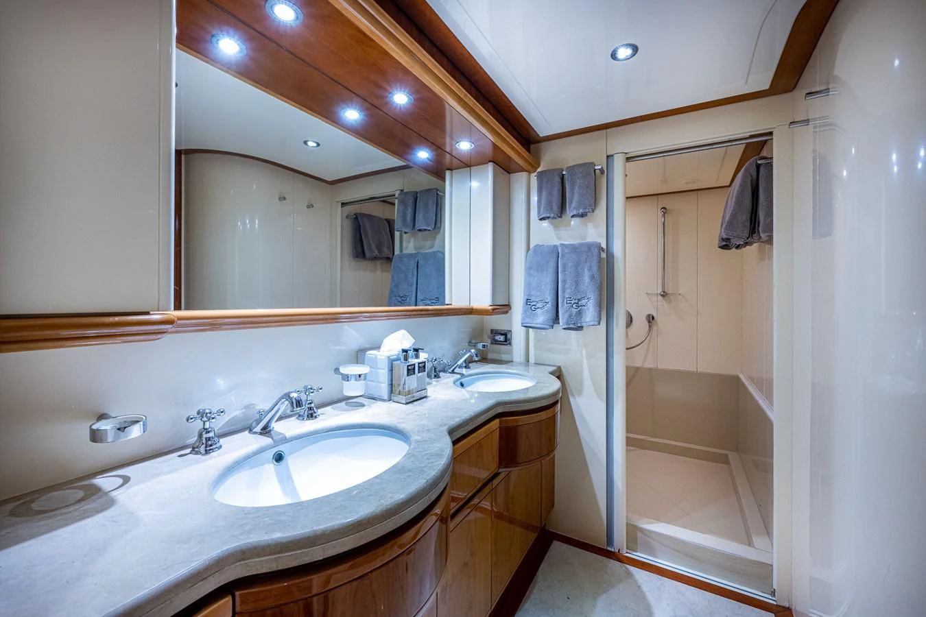 a bathroom with a large mirror aboard EVERYTHING GOOD Yacht for Sale