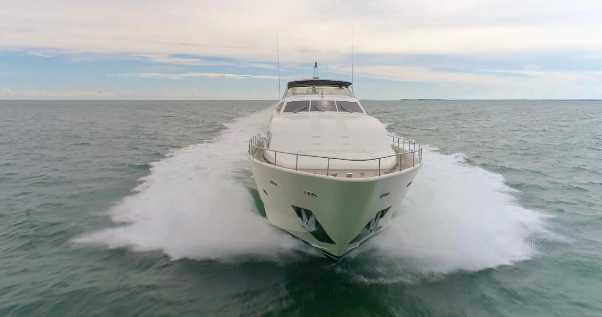 a white boat on the water aboard EVERYTHING GOOD Yacht for Sale