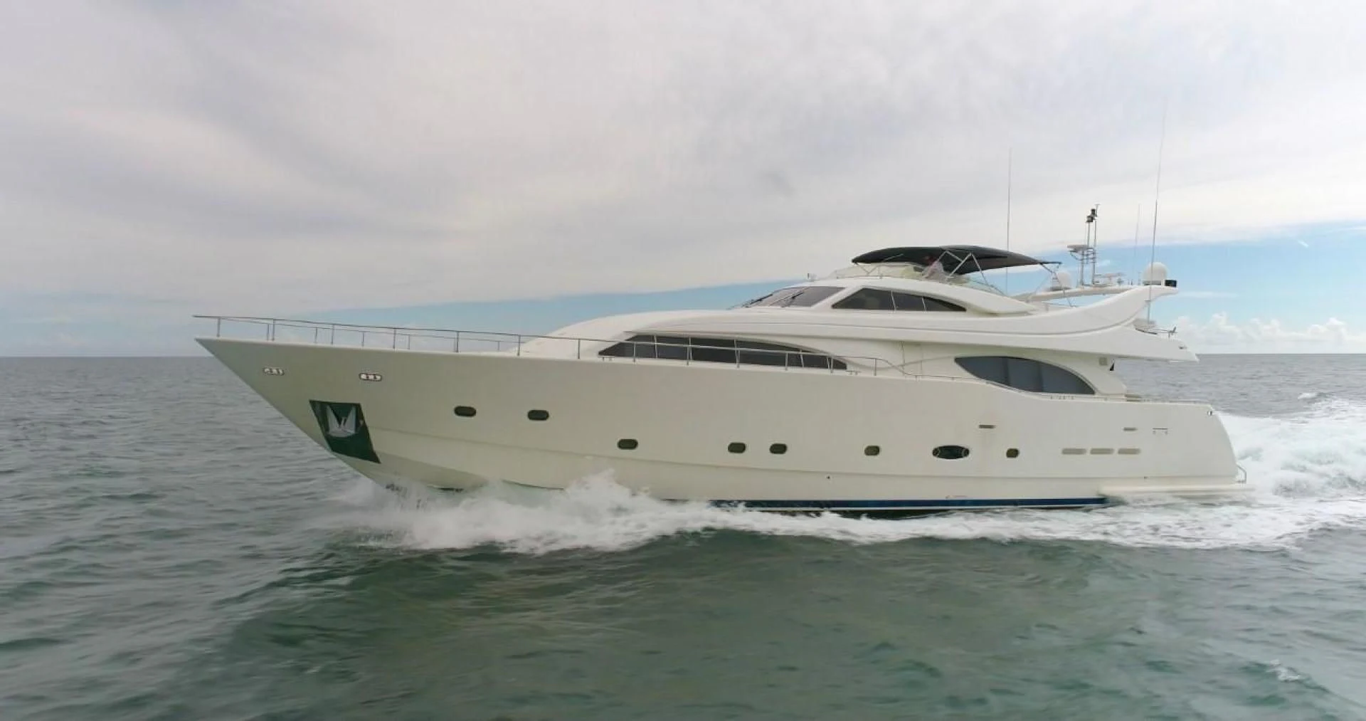 a white yacht in the water aboard EVERYTHING GOOD Yacht for Sale