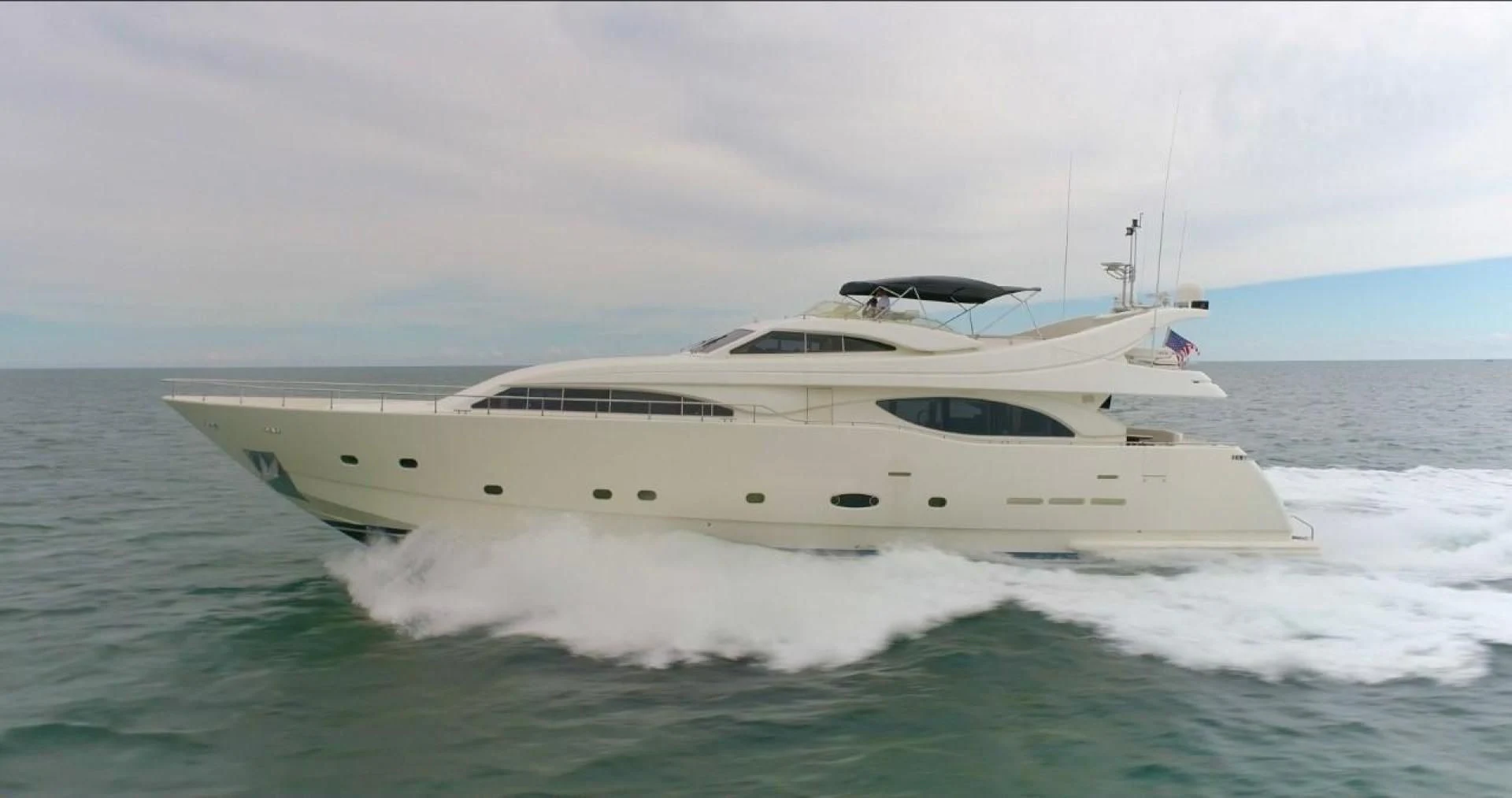 a white yacht on the water aboard EVERYTHING GOOD Yacht for Sale