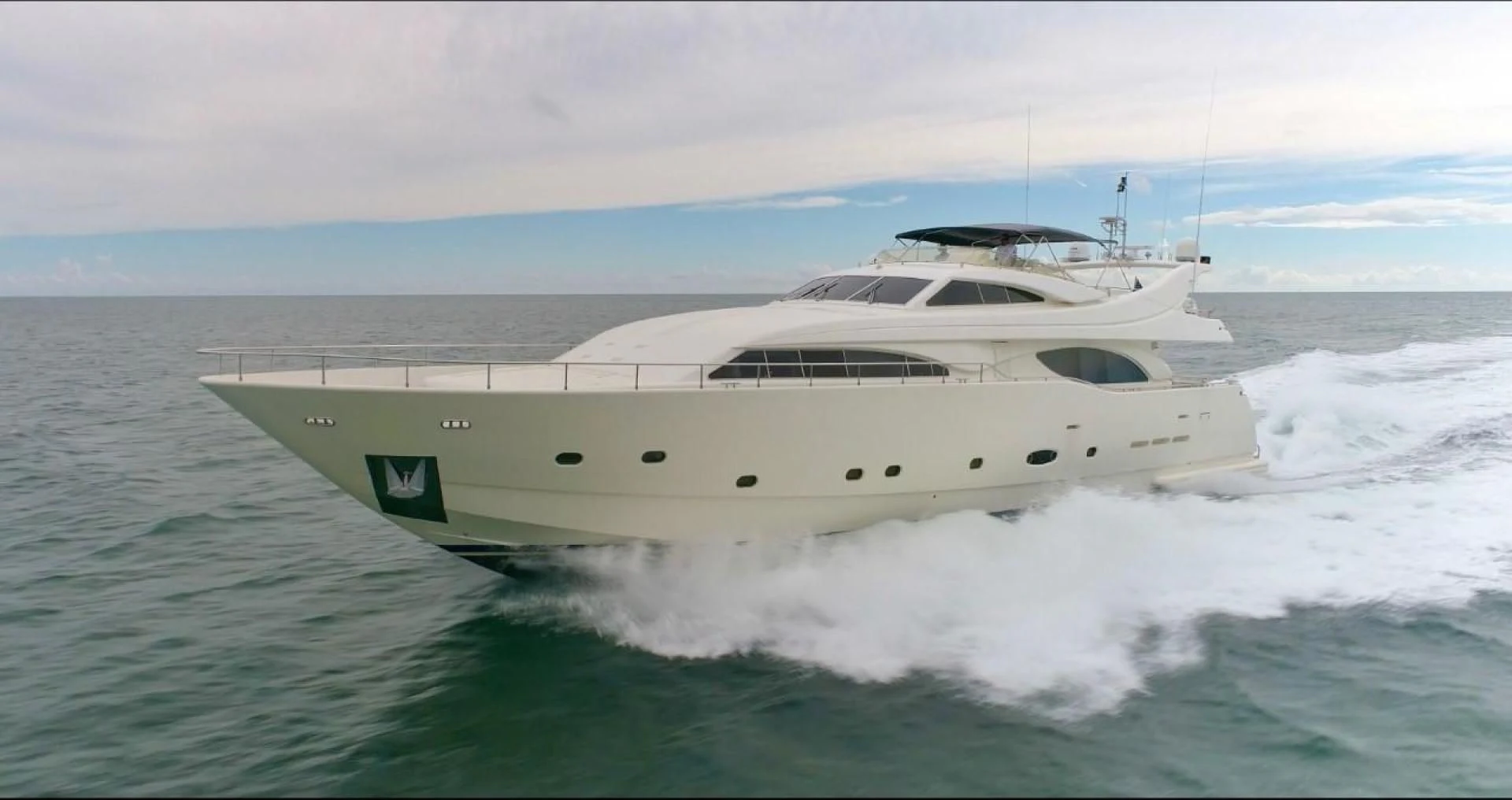 a white yacht on the water aboard EVERYTHING GOOD Yacht for Sale