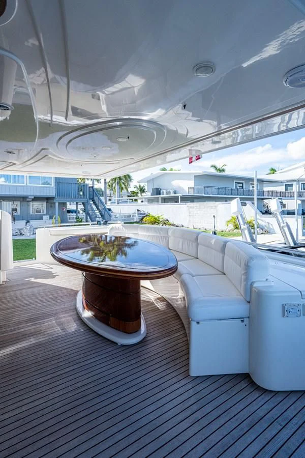 a table on a deck aboard EVERYTHING GOOD Yacht for Sale