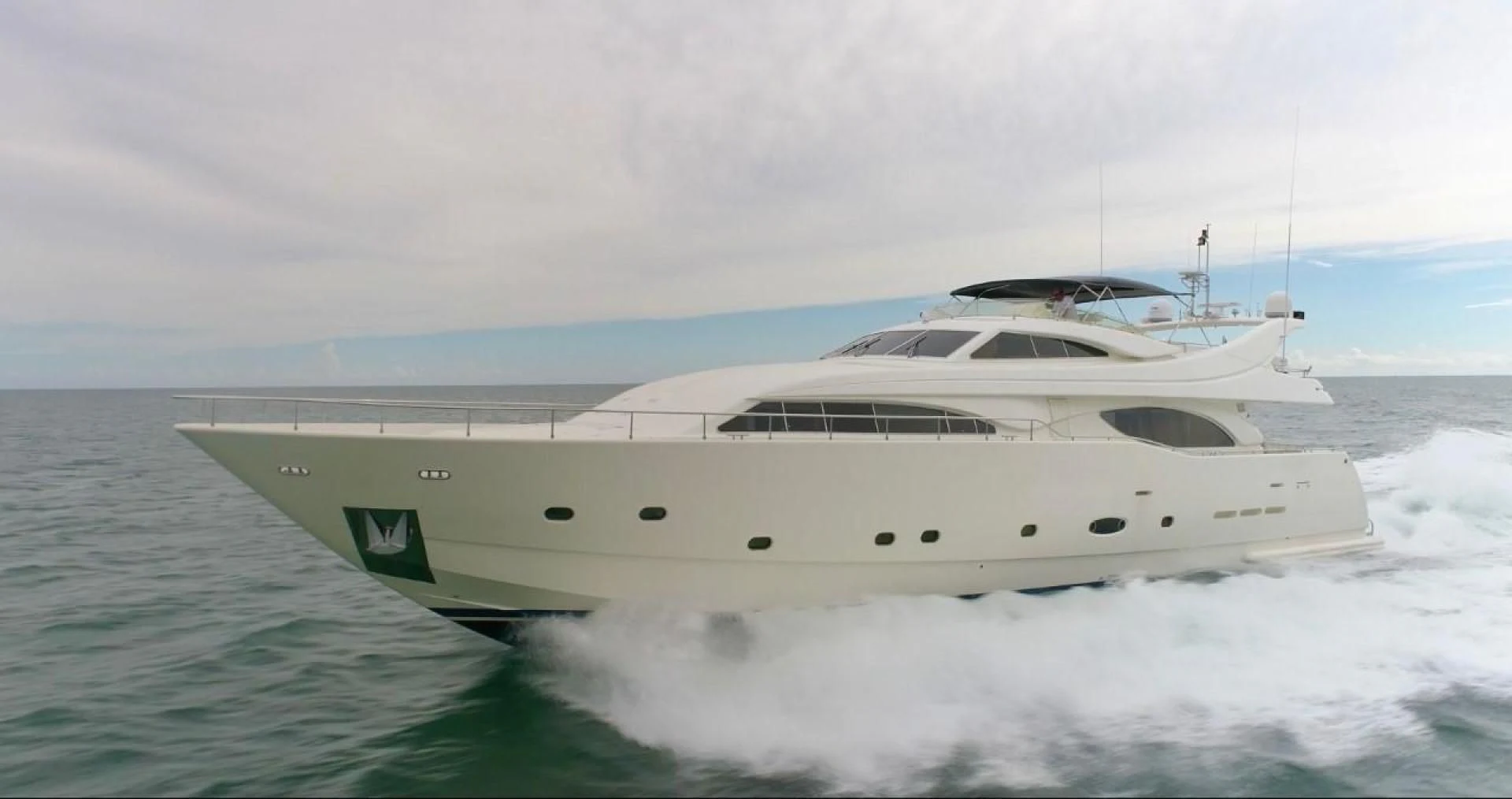 a white yacht on the water aboard EVERYTHING GOOD Yacht for Sale
