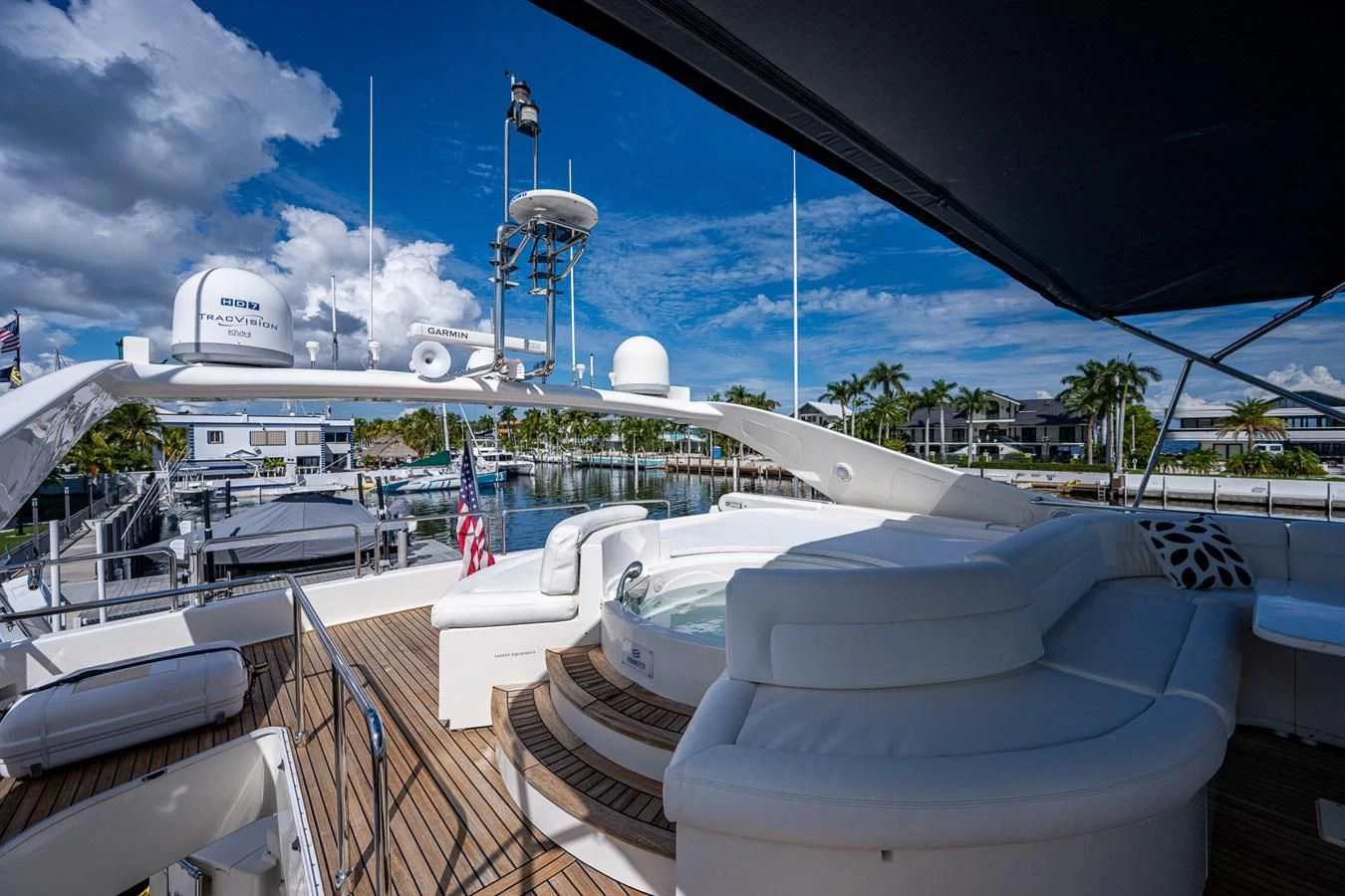a large white building with a ferris wheel and a blue sky aboard EVERYTHING GOOD Yacht for Sale