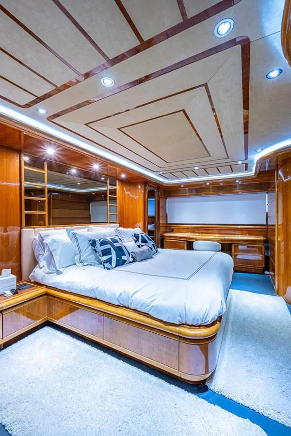a bed in a room aboard EVERYTHING GOOD Yacht for Sale