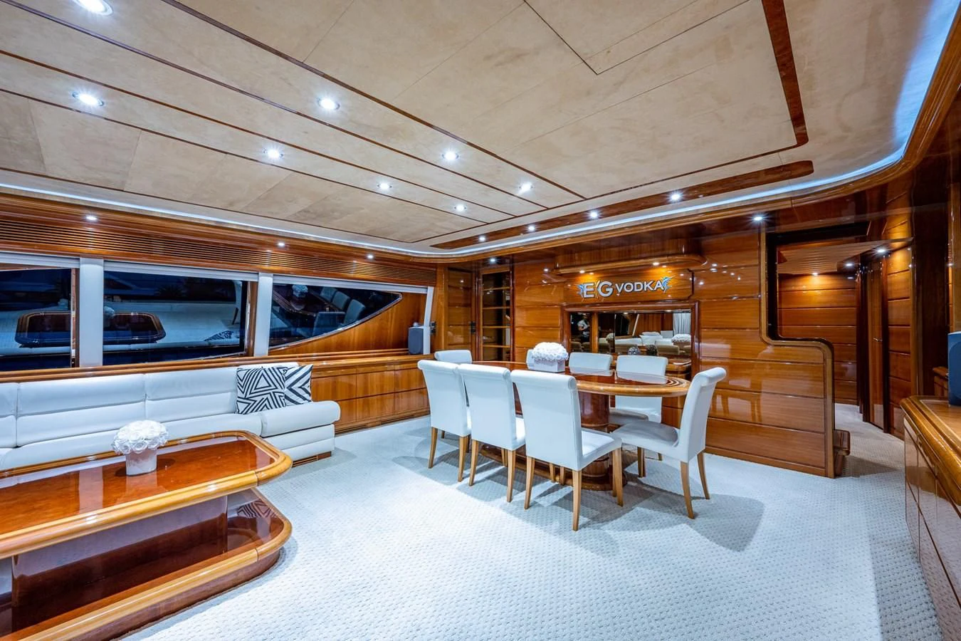 a room with a table chairs and a bench aboard EVERYTHING GOOD Yacht for Sale