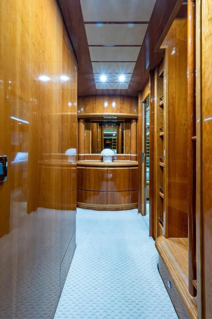 a room with a wood door and a glass wall aboard EVERYTHING GOOD Yacht for Sale