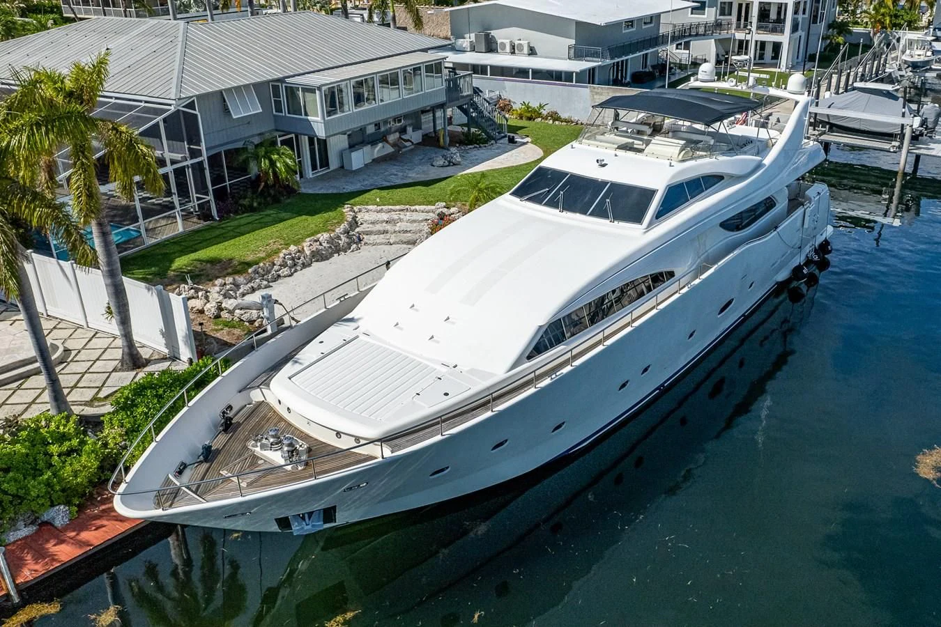 a large white boat in a harbor aboard EVERYTHING GOOD Yacht for Sale