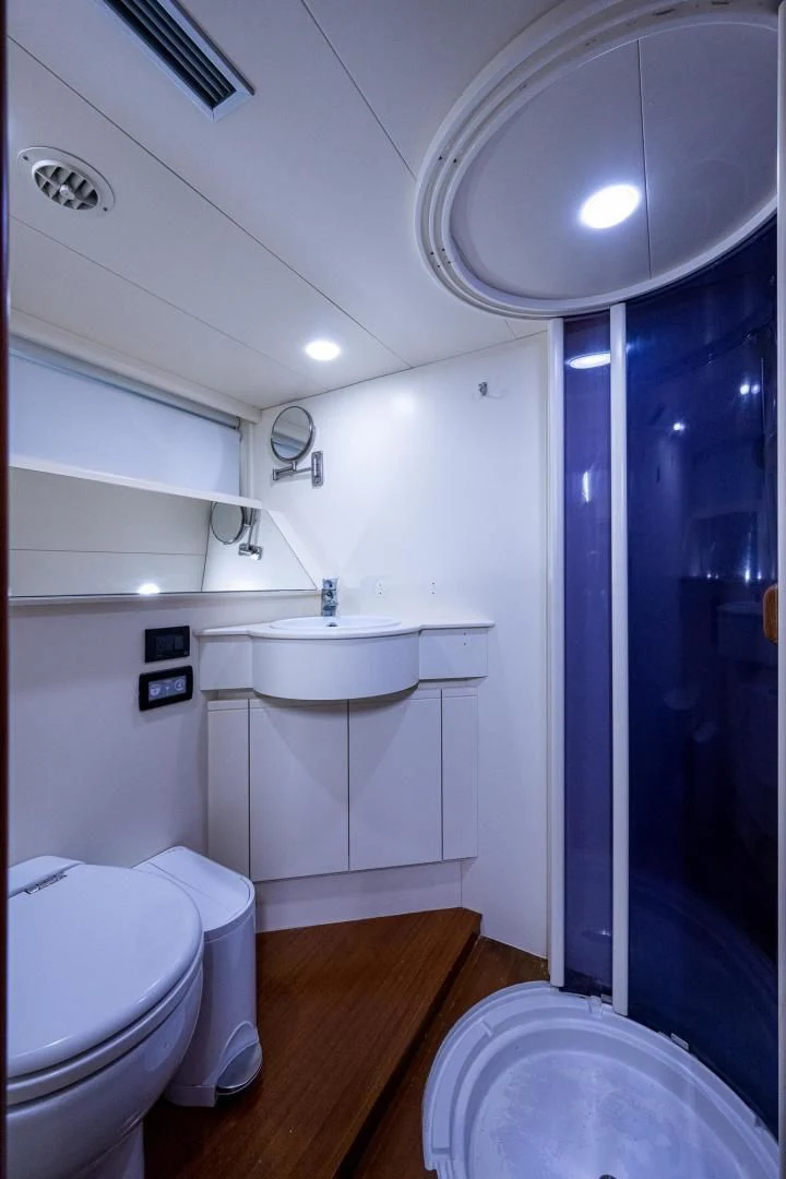 a bathroom with a sink toilet and bathtub aboard EVERYTHING GOOD Yacht for Sale