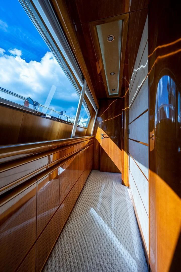 a walkway with a railing and a railing with a railing and a blue sky aboard EVERYTHING GOOD Yacht for Sale