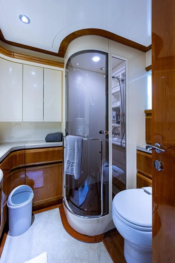 a bathroom with a glass shower aboard EVERYTHING GOOD Yacht for Sale