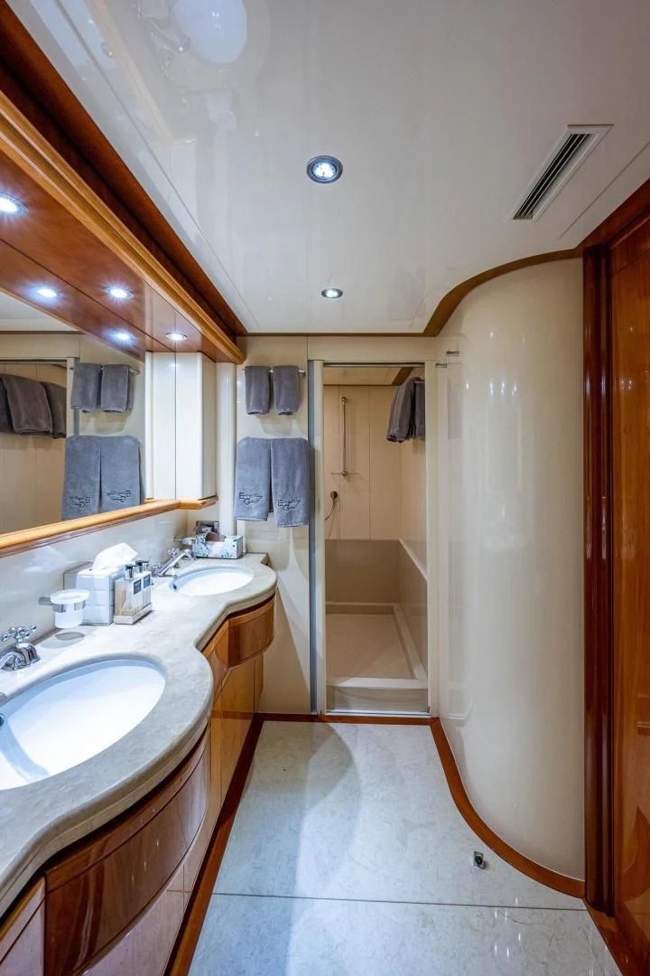a bathroom with a sink and a shower aboard EVERYTHING GOOD Yacht for Sale