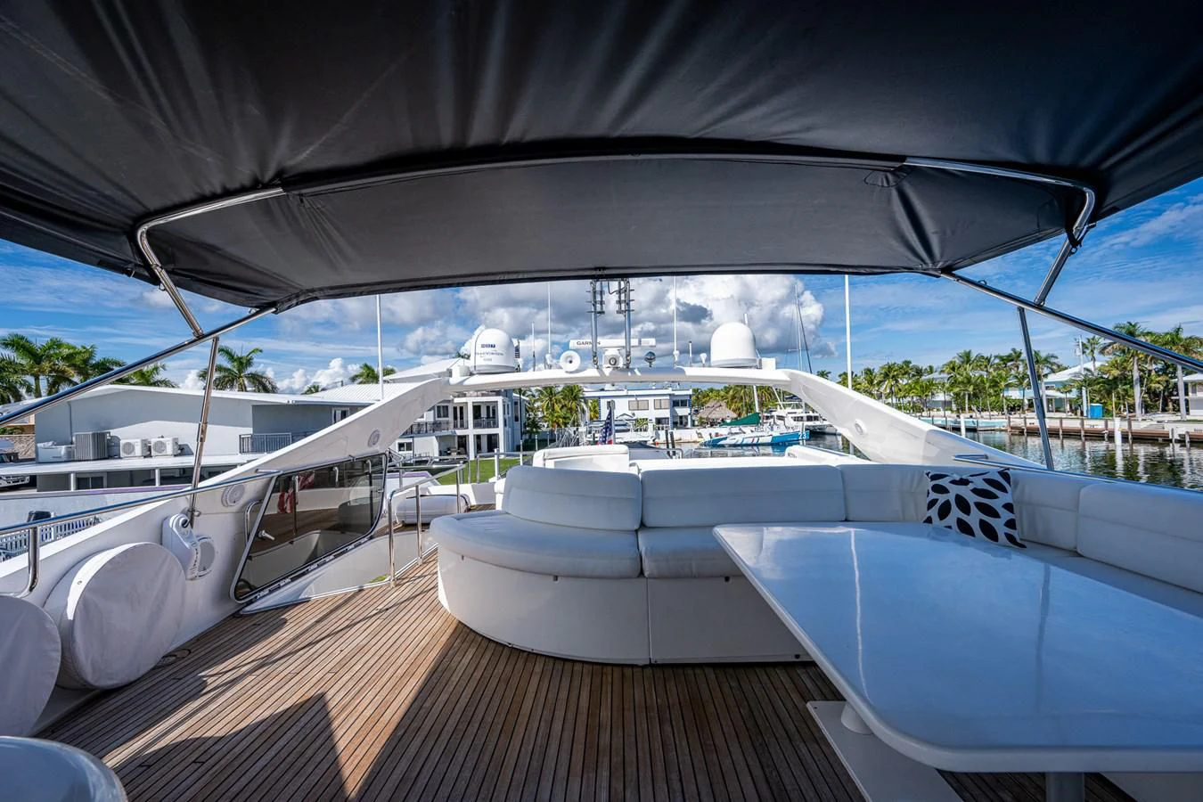 a deck with a large white boat and a large white building with a deck and a pool and aboard EVERYTHING GOOD Yacht for Sale