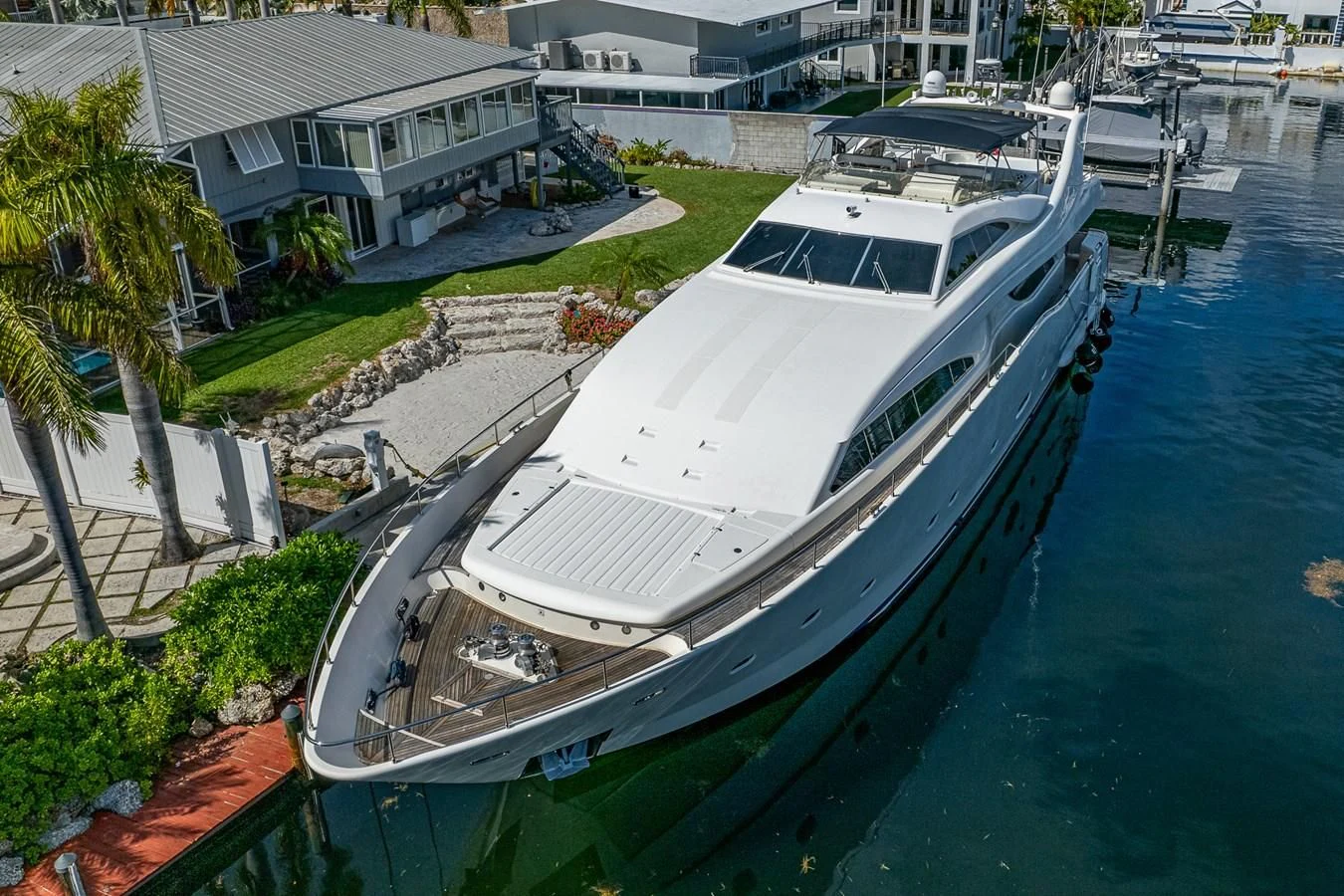 a large white boat in a harbor aboard EVERYTHING GOOD Yacht for Sale