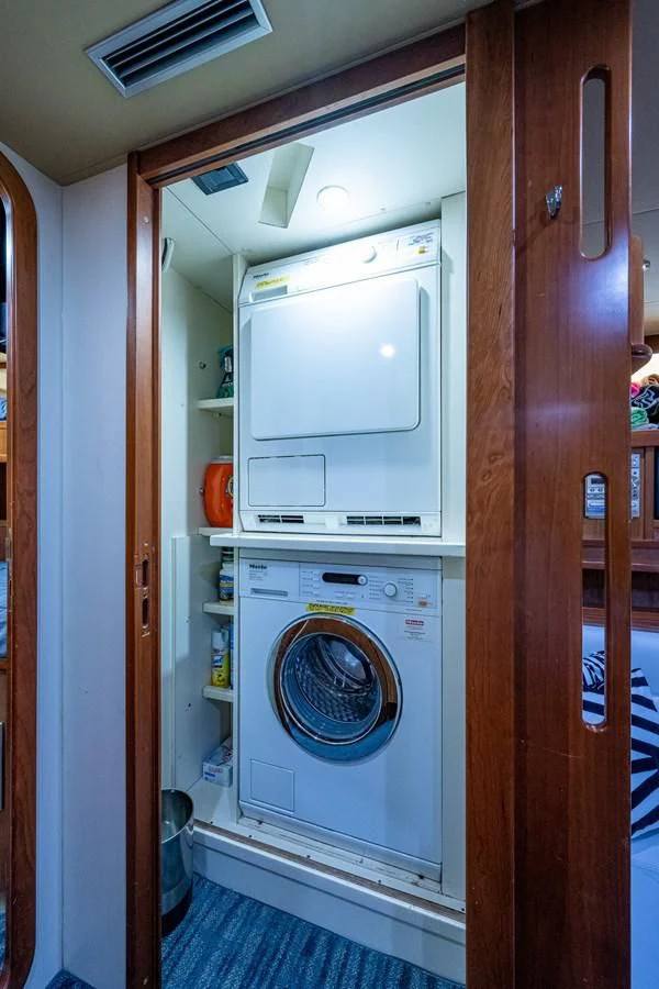 a washer and dryer in a closet aboard EVERYTHING GOOD Yacht for Sale