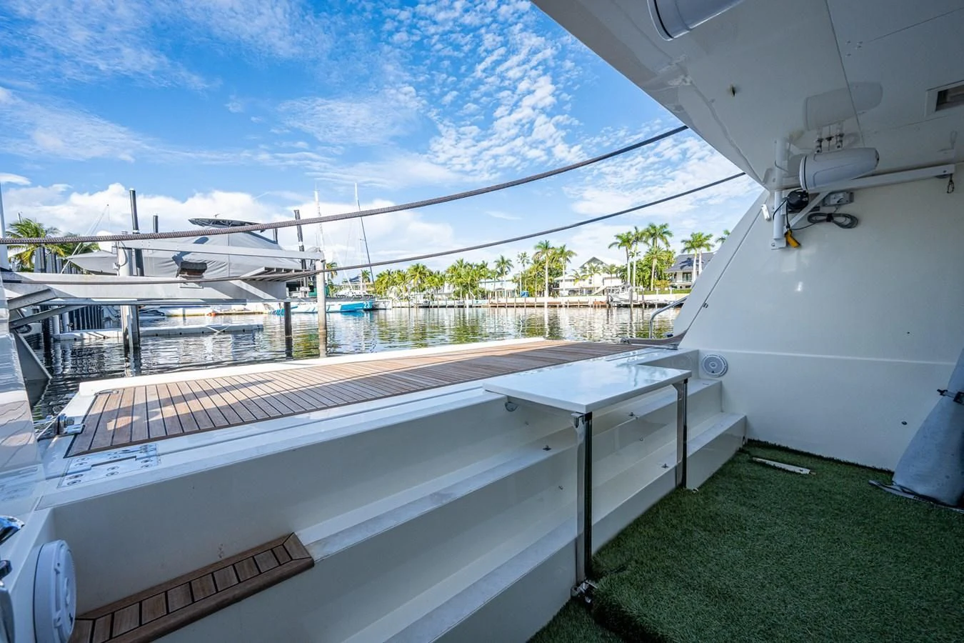 a large white building with a green lawn and a large white roof aboard EVERYTHING GOOD Yacht for Sale