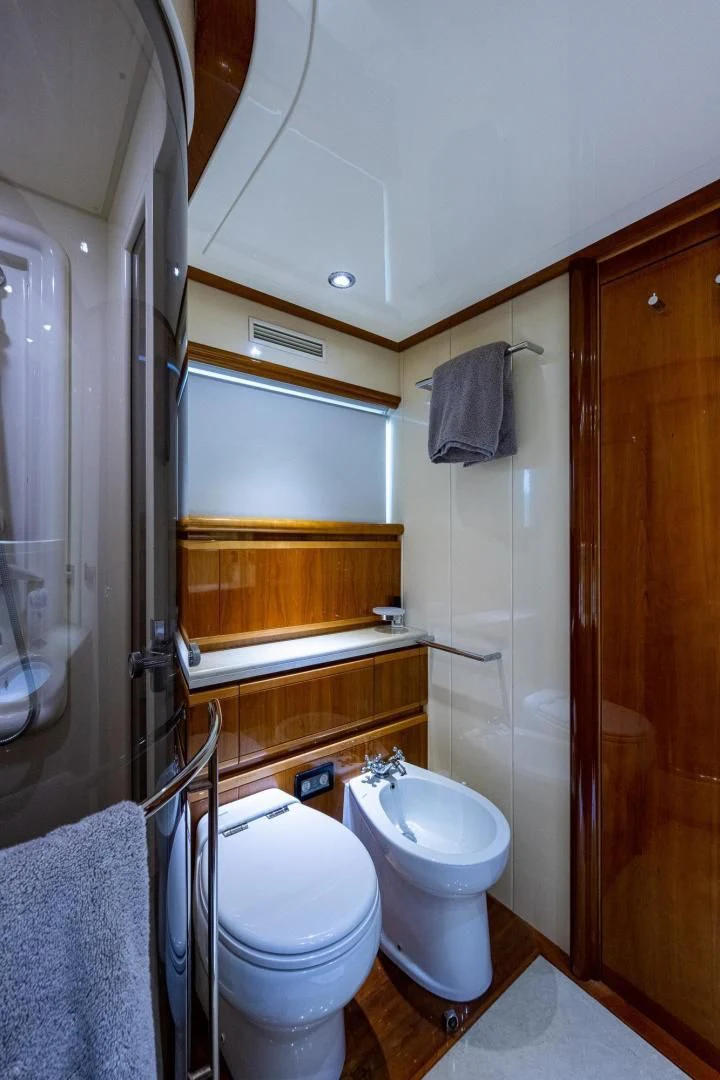 a bathroom with a toilet and a sink aboard EVERYTHING GOOD Yacht for Sale