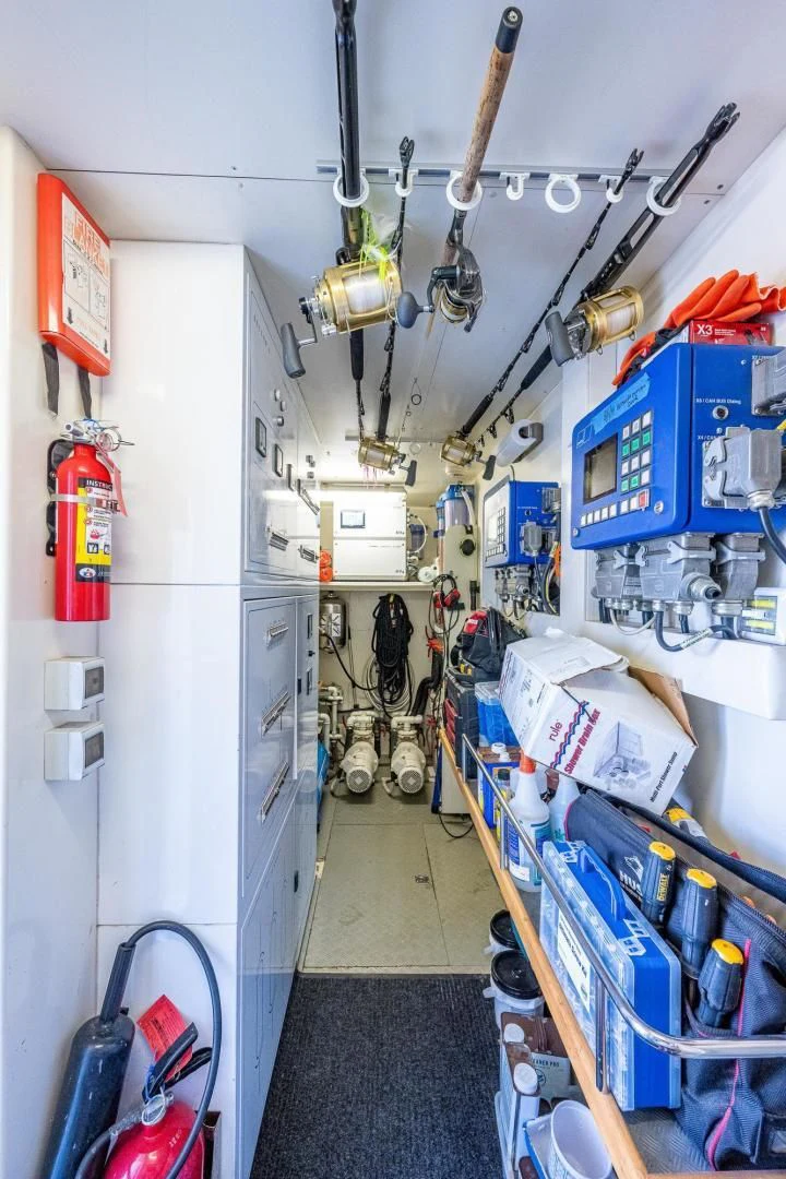 a room with shelves and tools aboard EVERYTHING GOOD Yacht for Sale