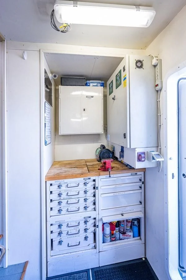 a white room with a white cabinet and a white cabinet aboard EVERYTHING GOOD Yacht for Sale