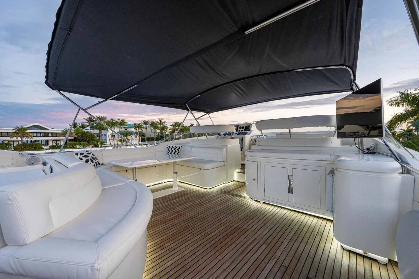 a deck with a large umbrella aboard EVERYTHING GOOD Yacht for Sale