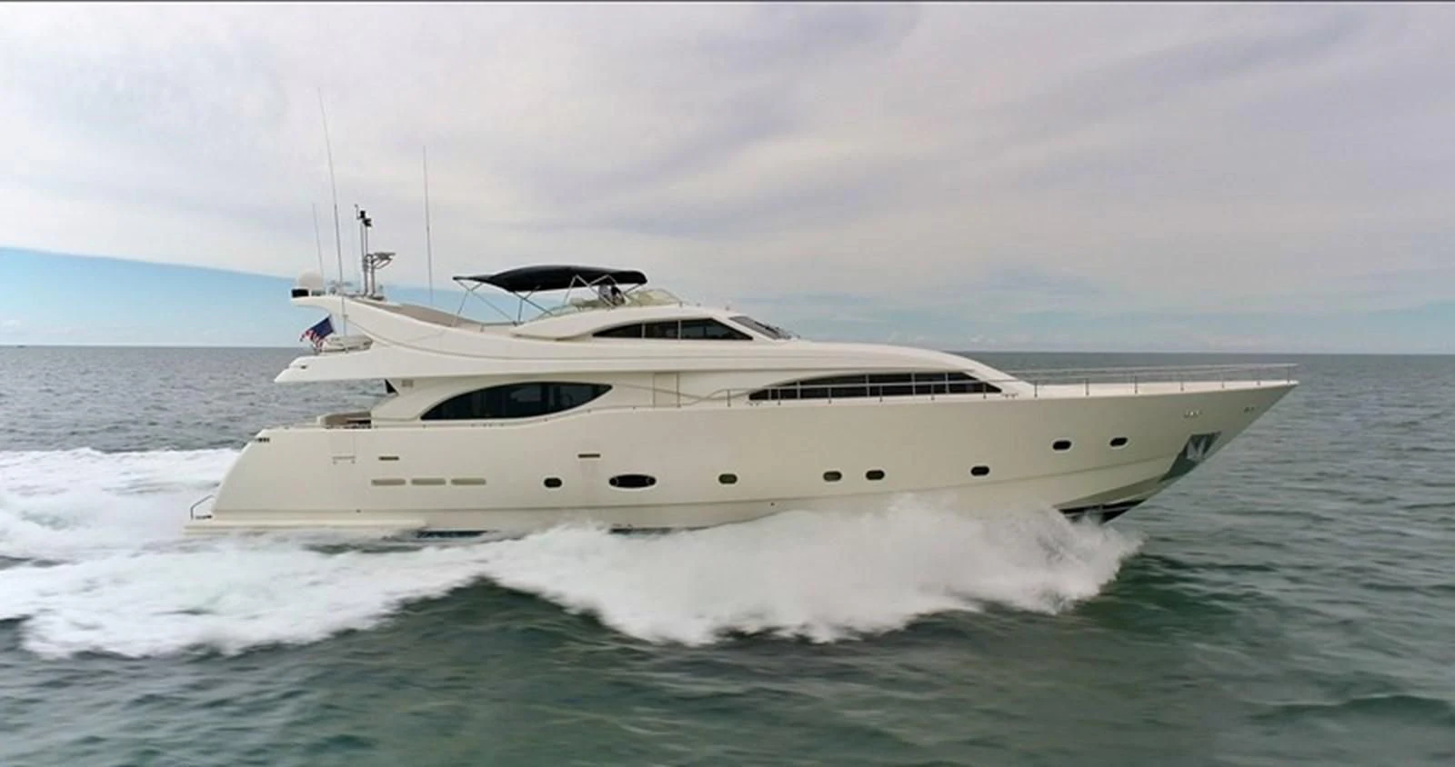 a white yacht on the water aboard EVERYTHING GOOD Yacht for Sale